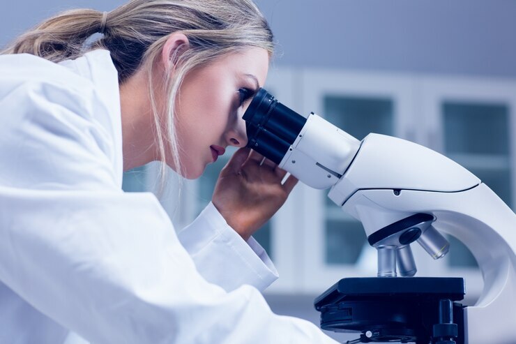 science student looking through microscope lab 13339 87029